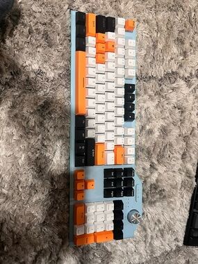 Custom Light Blue Mechanical Keyboard with White, Black & Orange Keycaps.